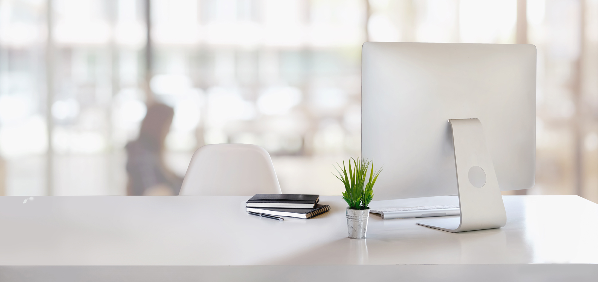 Stylish workspace with desktop computer, office supplies, houseplant and books at office. desk work concept.
